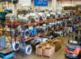 Lean manufacturing facility with metal coils, storage racks and a forklift